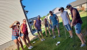 Golfers standing at ely open event
