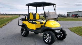 Black and yellow golf cart