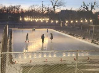 Ice Skaters on Ely Rink at Night
