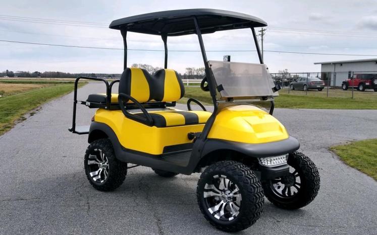 Black and yellow golf cart